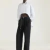 Asymmetrisk skjorte i poplin med paljetter Asymmetrisk skjorte i poplin med paljetter