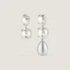 Spikete, asymmetriske øredobber i metall og perler Spikete, asymmetriske øredobber i metall og perler